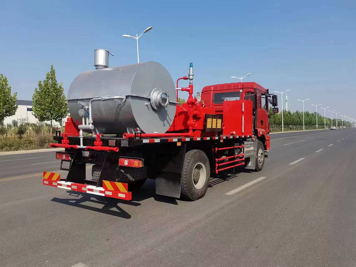 Well Flushing Truck in oilfield operation - hot oil wax removal truck working at wellsite in Central Asia